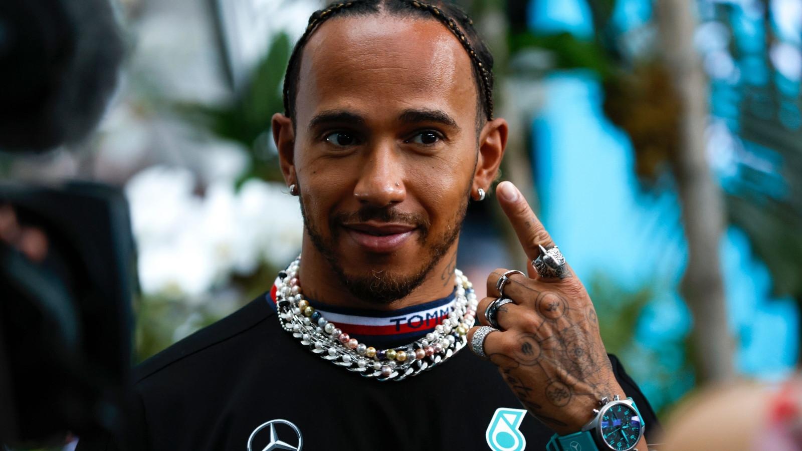 wzgkpdhv_6450dd18db479_lewis-hamilton-points-to-his-earring-planetf1.jpg